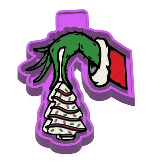 Grumpy hand holding a Christmas Cake Lights Mold